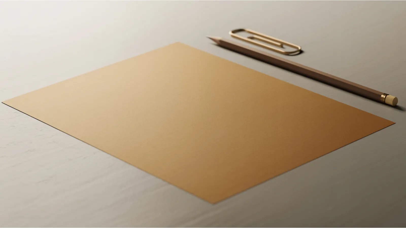 A single sheet of warm bone-white paper on a pale studio table with a brass paperclip and one sharpened pencil beside it, photographed from overhead in soft light with generous empty space.